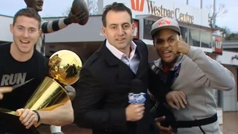 Patty Mills, Aron Baynes And The Larry O’Brien NBA Trophy Crashed A Live TV Cross