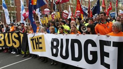 Tens Of Thousands March In New Wave Of ‘Bust The Budget’ Protests
