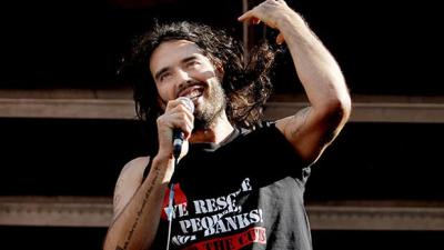 Russell Brand Reckons Tony Abbott Is A “Raving Lunatic”