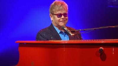 WATCH: Elton John Pays Tribute To Bowie With A+ Melding Of Melodies