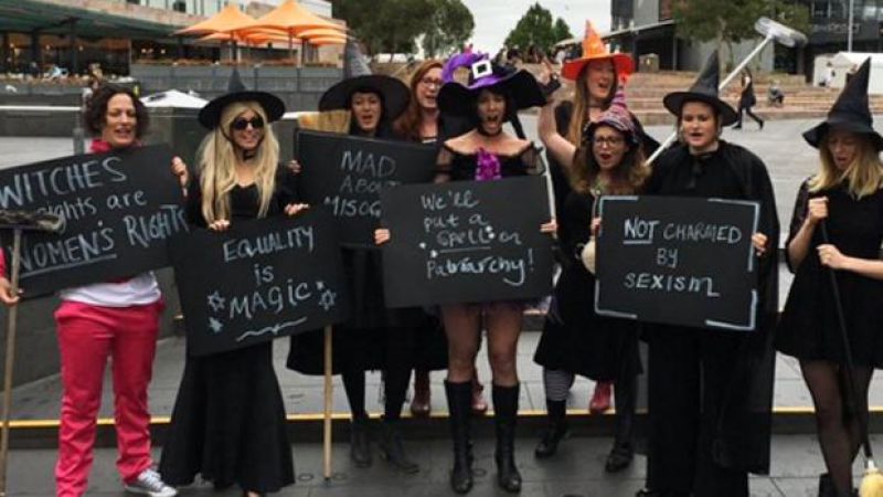 Broomstick-Toting Witches Staged A Protest Outside Peter Dutton’s Office