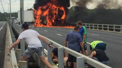 WATCH: Aussie Hero In “One Inch Thongs” Rescues Driver From Burning Truck
