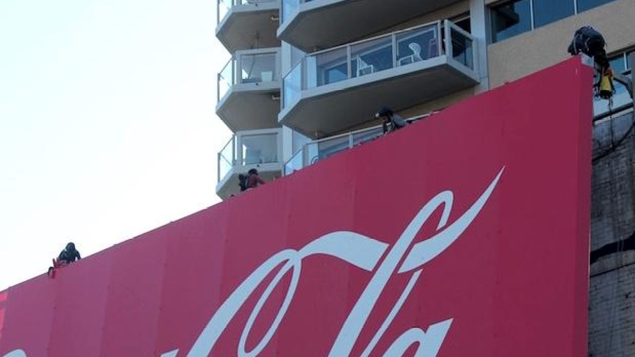 Activists Staged A Dramatic Protest On The Kings Cross Coke Sign This Morn