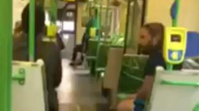 WATCH: Racist Idiot Abuses And Threatens Passengers On A Melbourne Tram