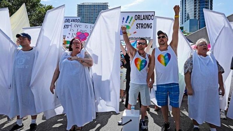 ‘Angels’ Block Westboro Protesters From Slinging Hate At Orlando Mourners
