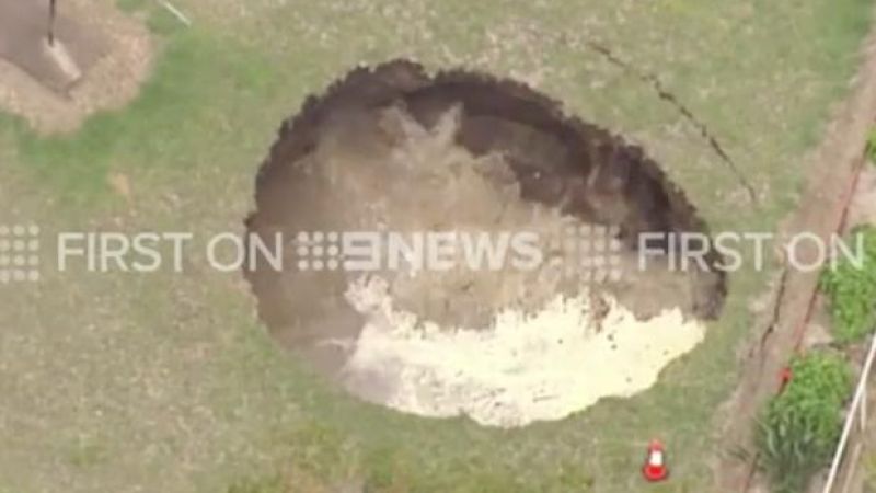 WATCH: Gaze Upon This Sinkhole Slowly Swallowing A QLD Backyard And Weep