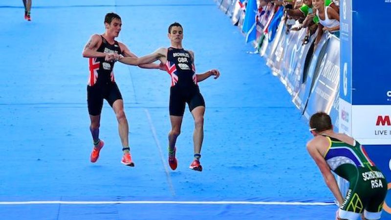 WATCH: Triathlete Gives Up 2nd To Carry Knackered Bro Over Finish Line