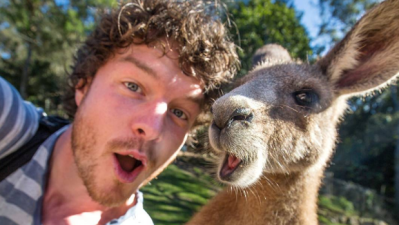 Kiwi Who Takes Selfies W/ Animals Around The World Is Living His Best Life