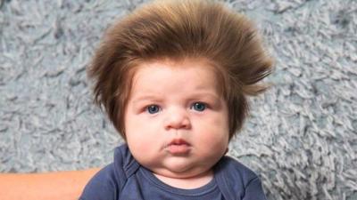 AWKS: ‘The Project’ Accidentally Photobombs Own Story With Big-Hair Baby