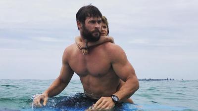 Chris Hemsworth Surfing With His Tiny Daughter Has Just About Done Us In