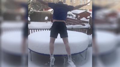 Please Enjoy This Video Of A Bloke Jumping Onto A Snow-Covered Trampoline