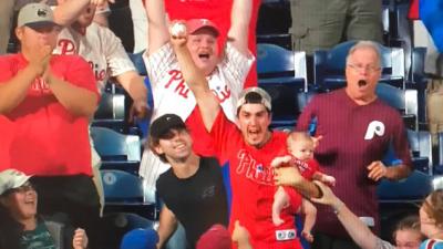 Man Catches Home Run While Holding Baby To Become Most Powerful Dad Alive