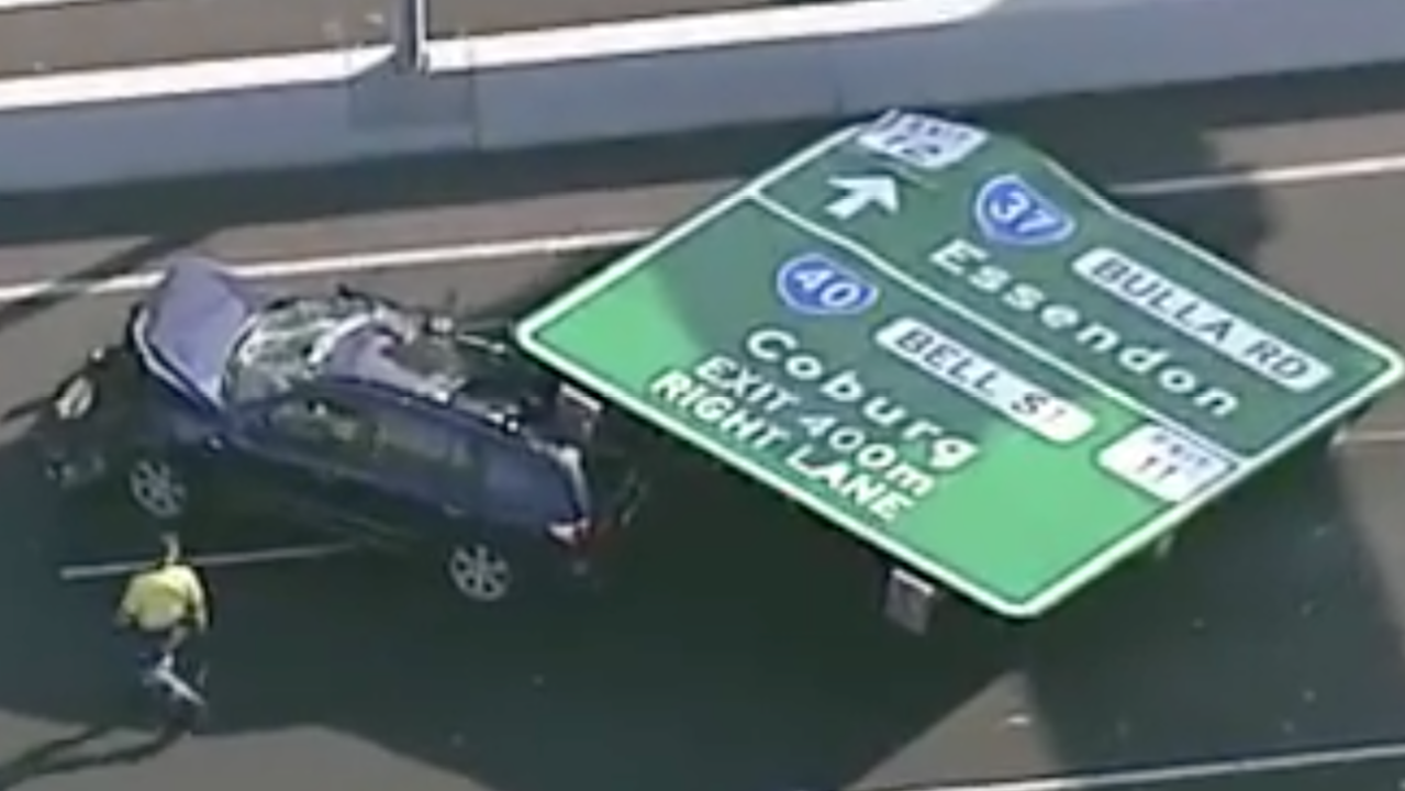 Woman Hospitalised After Tullamarine Freeway Sign Crushes Car In Peak Hour
