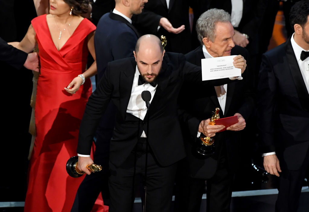 'La La Land' producer Jordan Horowitz holds up the winner card reading actual Best Picture winner 'Moonlight'. (Photo by Kevin Winter/Getty Images)