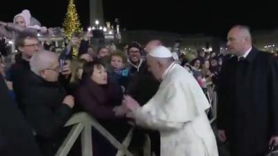 Meanwhile, Here’s Pope Francis Full On Slapping A Woman’s Hand After She Yanked At Him