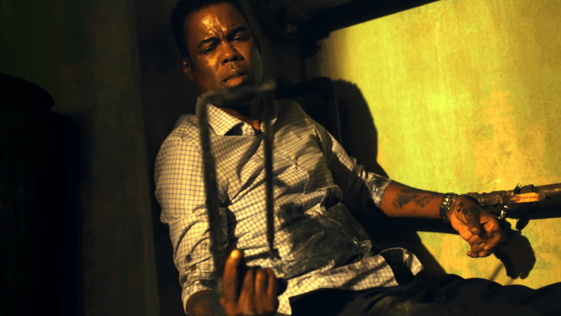 Chris Rock Bloody Goes For It In The Trailer For ‘Spiral’, His New ‘Saw’ Spinoff