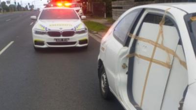 VIC Police Stop Man Trying To Drive To WA In A Car With One Door Literally Sticky Taped On