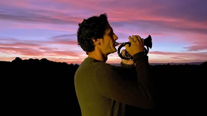 Andy Lee Plays The Last Post On His Driveway As Aussies Light Up The Dawn For ANZAC Day