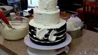 Some Lunatic Made An Entire Wedding Cake From $60 Worth Of Woolies Mud Boys