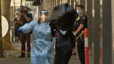 In Chaotic Scenes, The Holiday Inn Evacuated Quarantined Guests W/ Garbage Bags On Their Heads