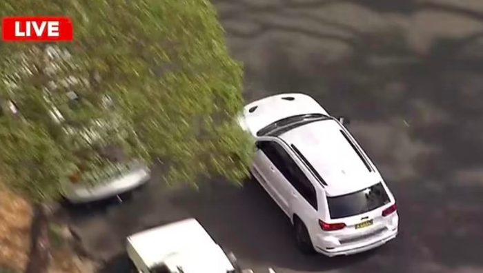 Helicopter footage of Gladys Berejiklian's jeep from Channel 9. 