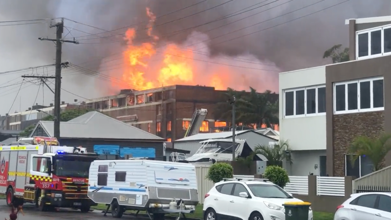 NSW Police Have Evacuated Newy Locals From A Huge Warehouse Fire And The Vids Are Insane