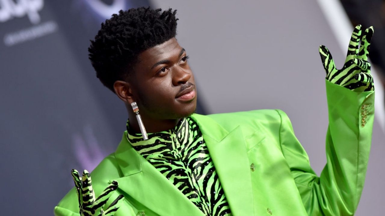 Lil Nas X in a lime green suit.