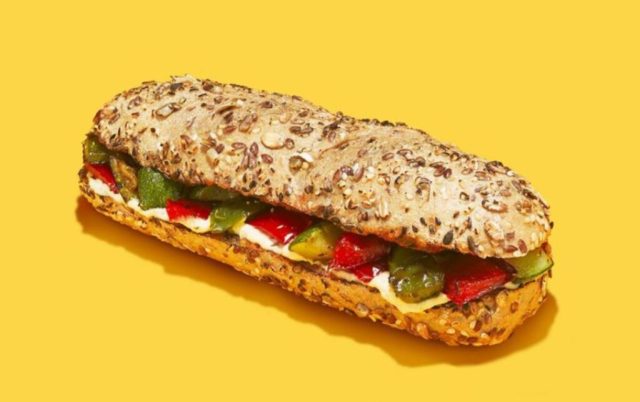 a easyjet sandwich ad depicting a veggie filled baguette on a yellow background