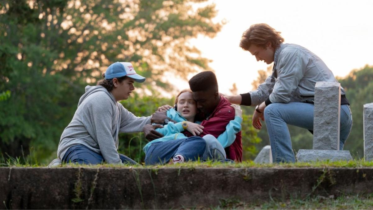 A scene in Stranger Things where Max (Sadie Sink) is held by her friends while Kate Bush's Running Up That Hill plays.