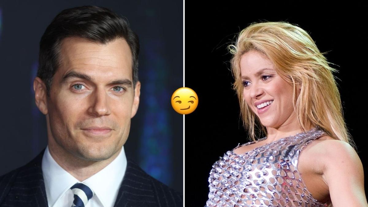 shakira smirking at a picture of Henry Cavill