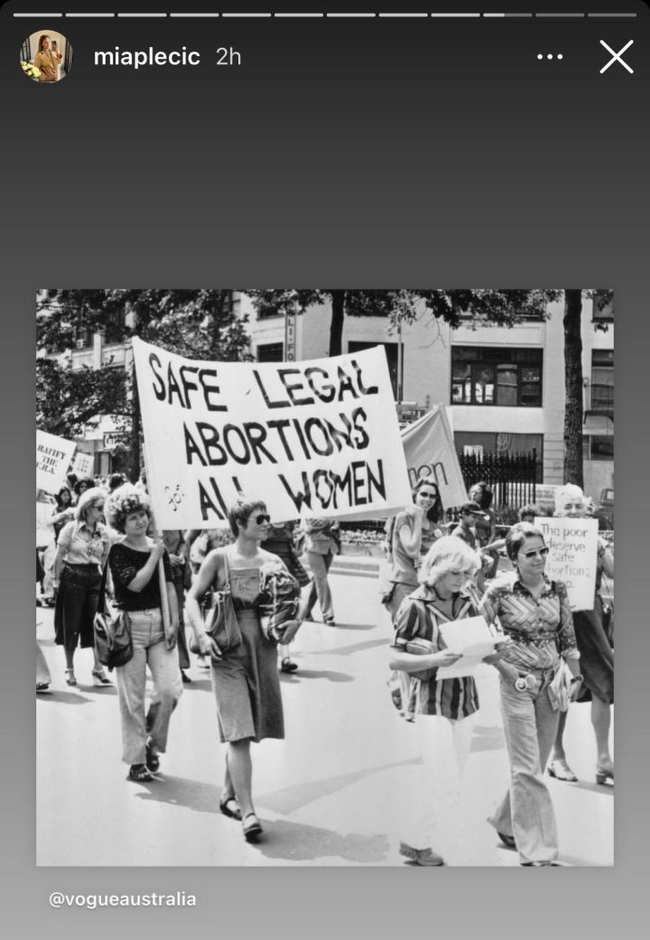 Screenshot of an Instagram story by Aussie influencer Mia Plecic, sharing a post originally posted by Vogue Australia showing women at a pro-abortion protest