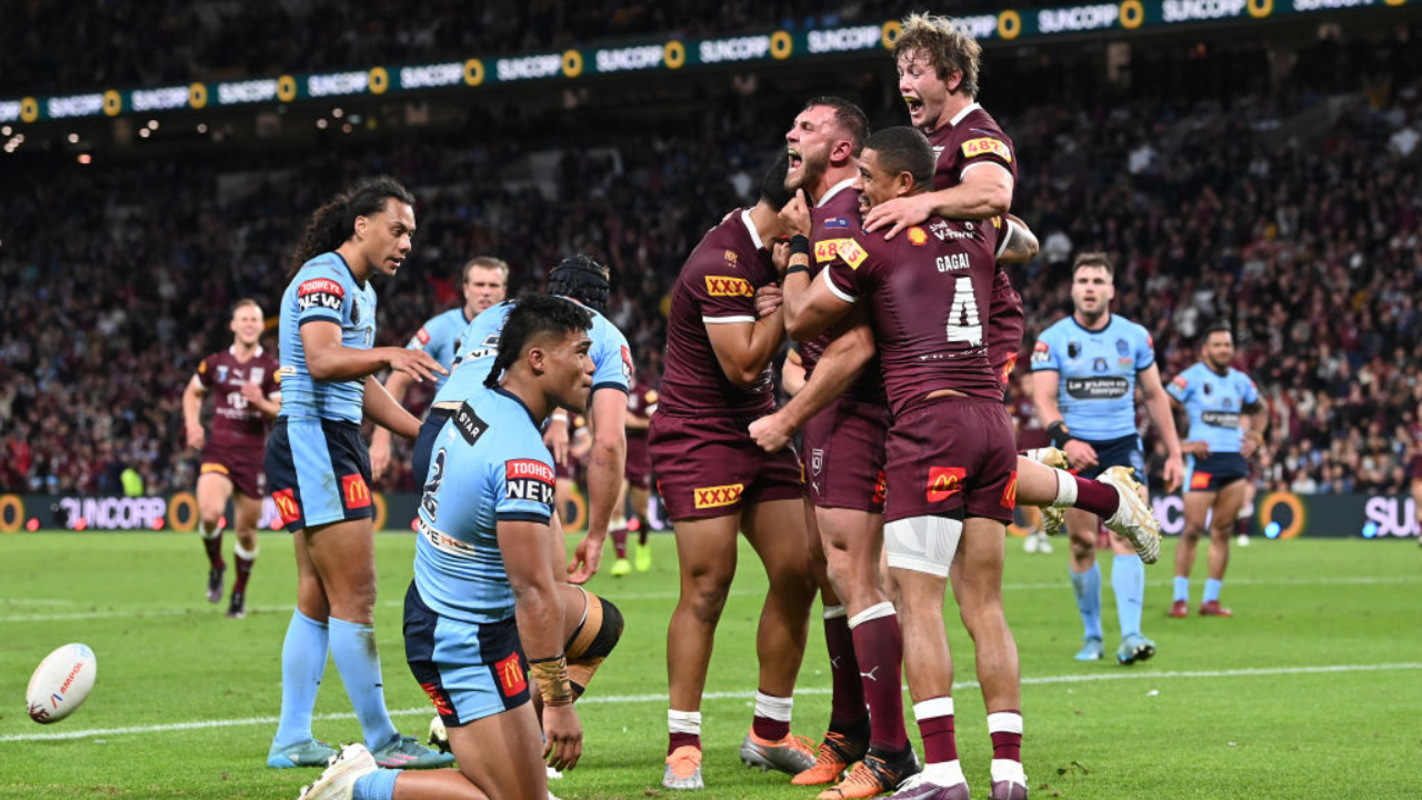 Queensland Maroons celebrating their State of Origin 2022 win against NSW Blues