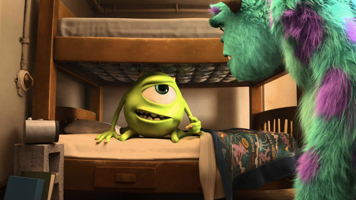 Mike Wazowski in Monsters University sitting on a bunk bed speaking to Scully