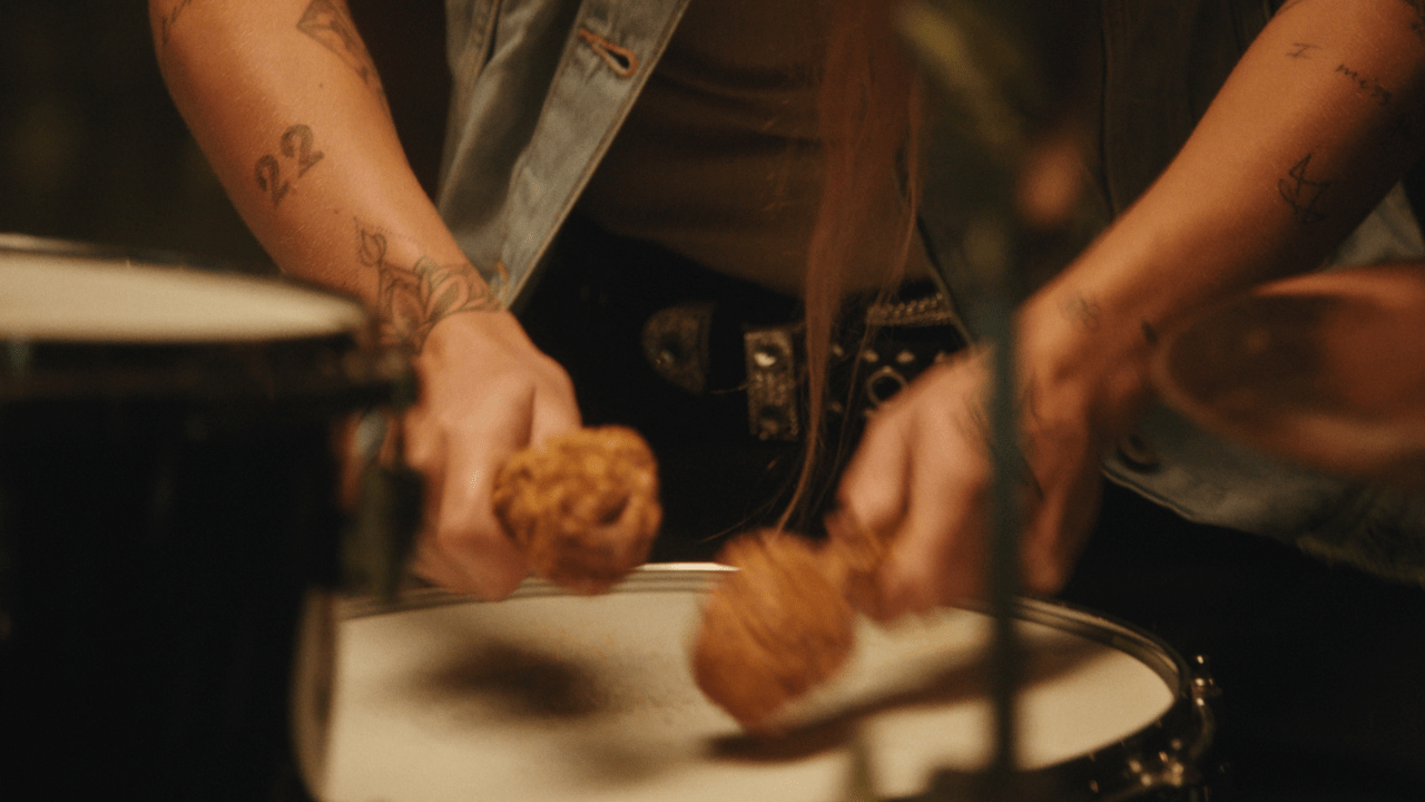 Aussie muso G Flip using KFC drumsticks to play drums in Uber Eats ad