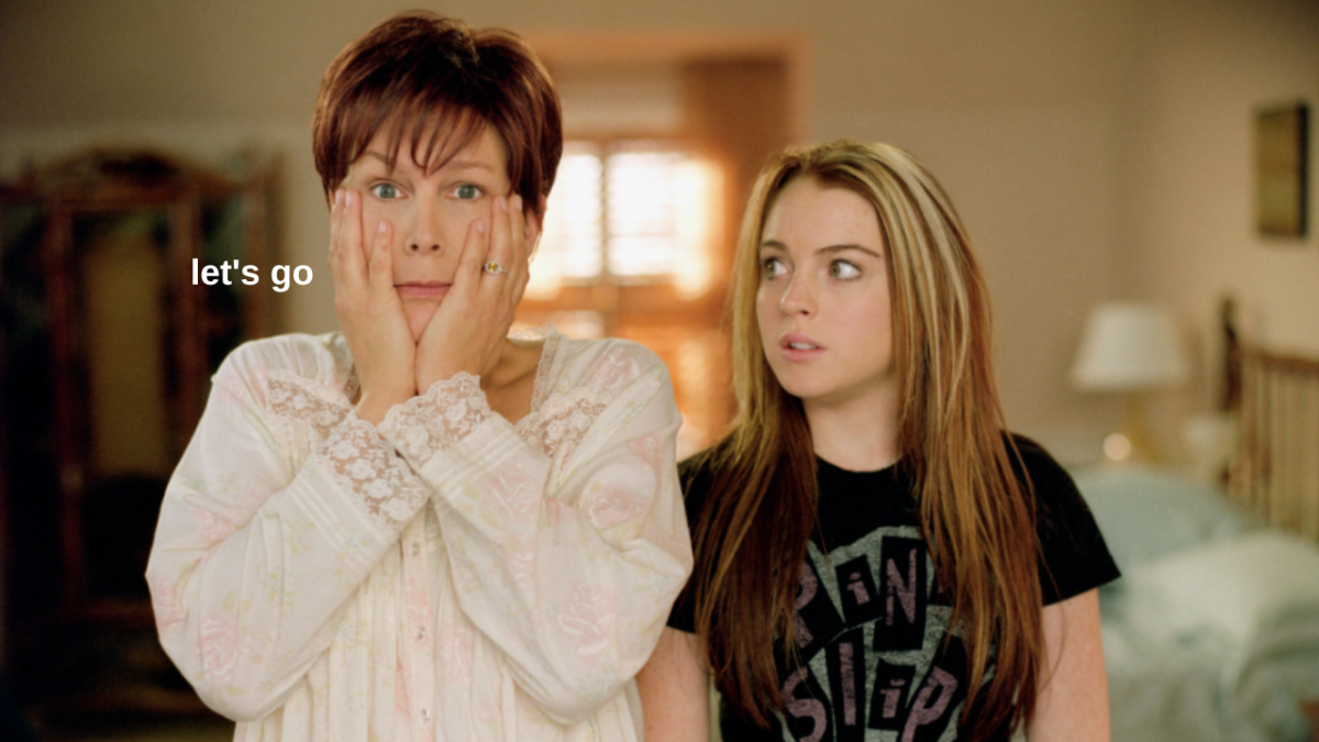 Jamie Lee Curtis in a white nightgown with her hands to her facing looking shocked and Lindsay Lohan in black t-shirt looking at her concerned in Freaky Friday
