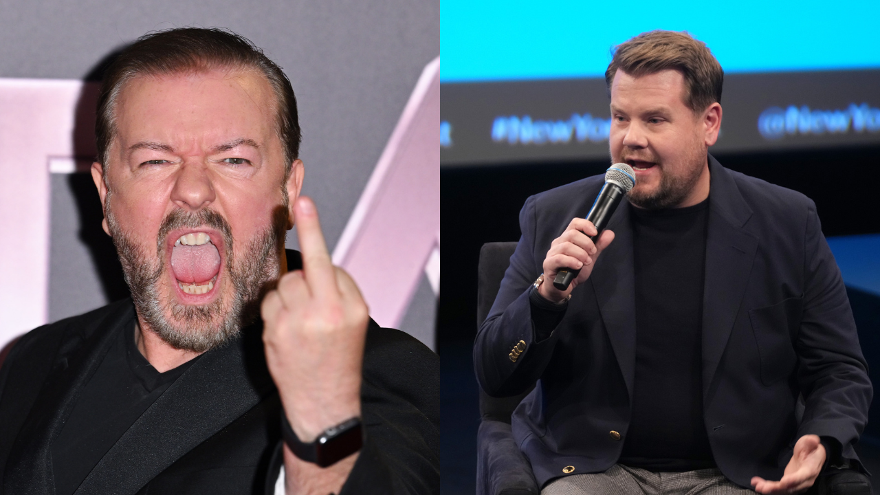 British comedian Ricky Gervais in a black suit giving the rude finger and talkshow host James Corden onstage in a black shirt and grey suit holding a microphone talking