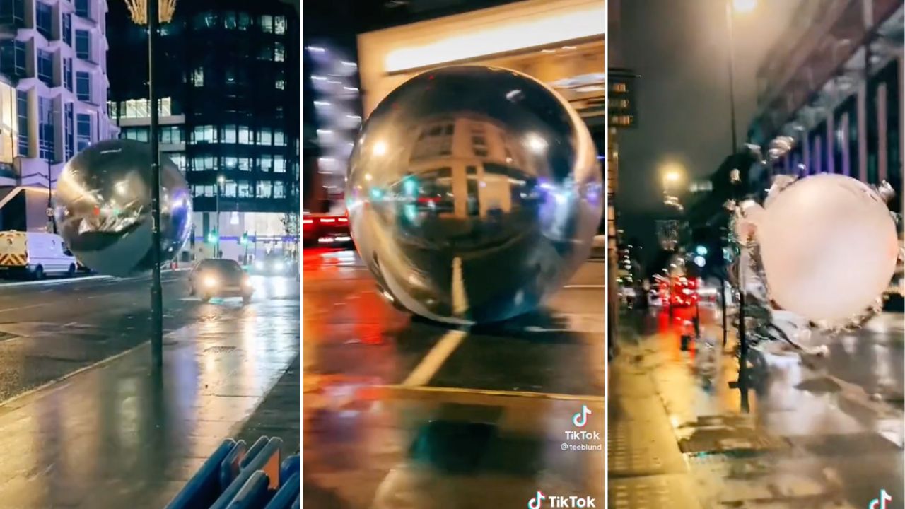 christmas baubles roll down London street
