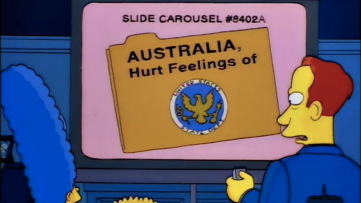 Marge and Bart Simpson watching a presentation with a dossier on screen called "Australia, Hurt Feelings of" in The Simpsons.