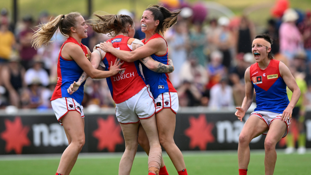 Tayla Harris of the Demons celebrates kicking a goal with team mates during the AFLW Grand Final match between the Brisbane Lions and the Melbourne Demons.