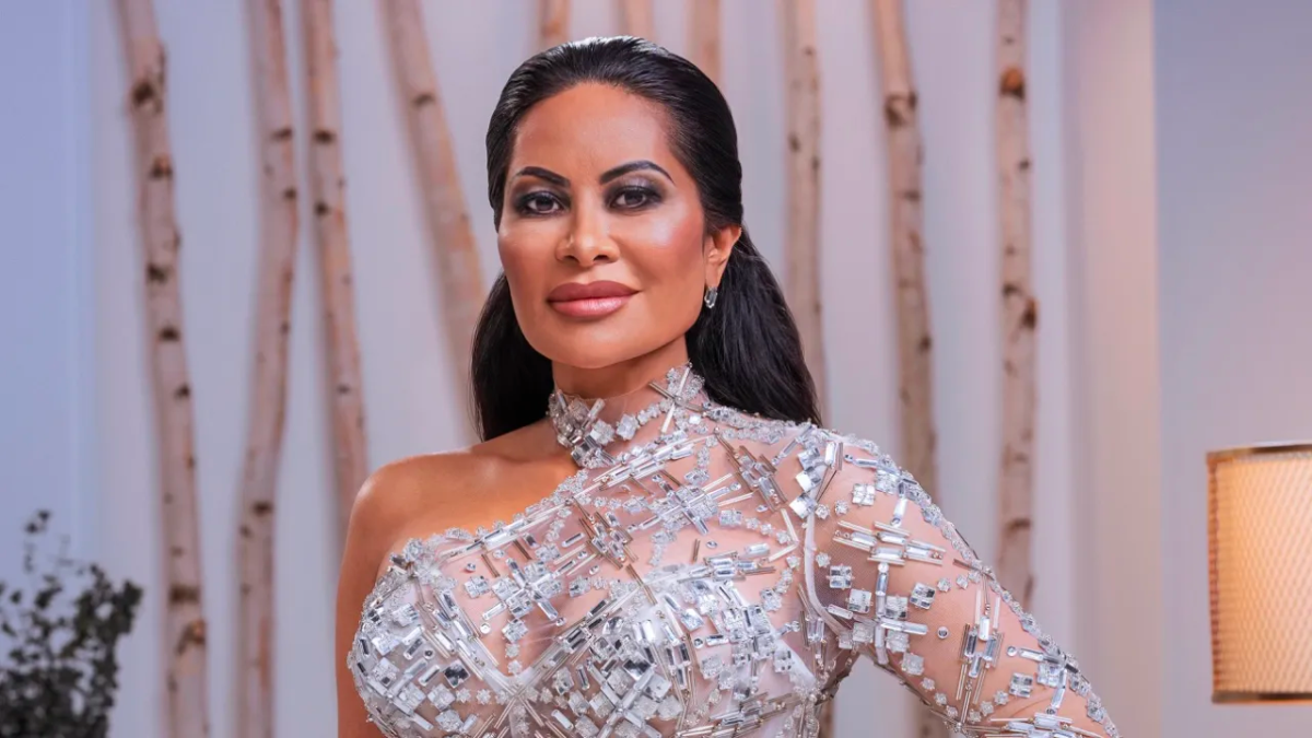 Real Housewives of Salt Lake City star Jen Shah posing in a photo wearing a bedazzled high neck gown