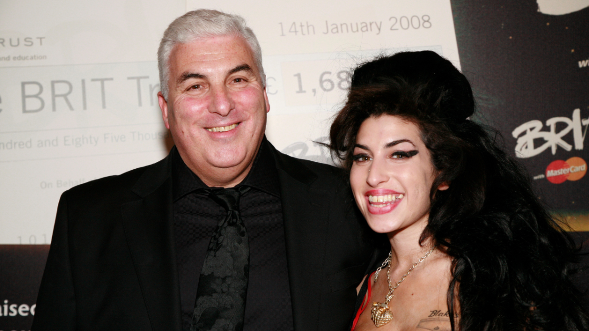 Mitch Winehouse and his daughter Amy Winehouse backstage at The BRIT Awards 2008