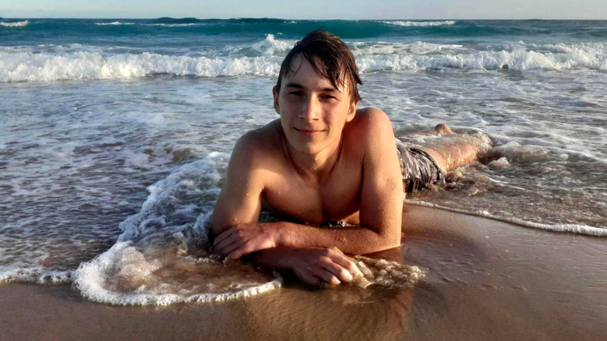 Ivan Korolev, who tragically drowned while swimming with friends at Freshwater Beach, laying on the sand at a beach