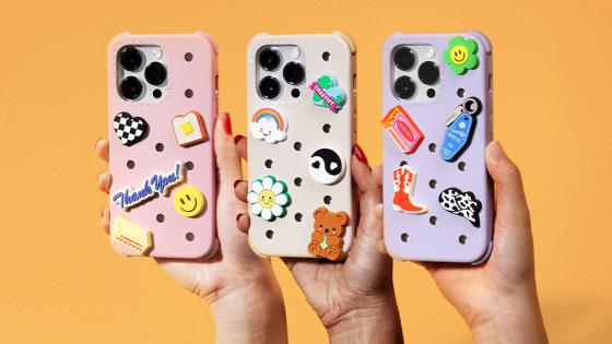 Phone Cases That Have The Same Charm-Covered Vibe As Yr Fave Crocs Now Exist So RIP My Wallet