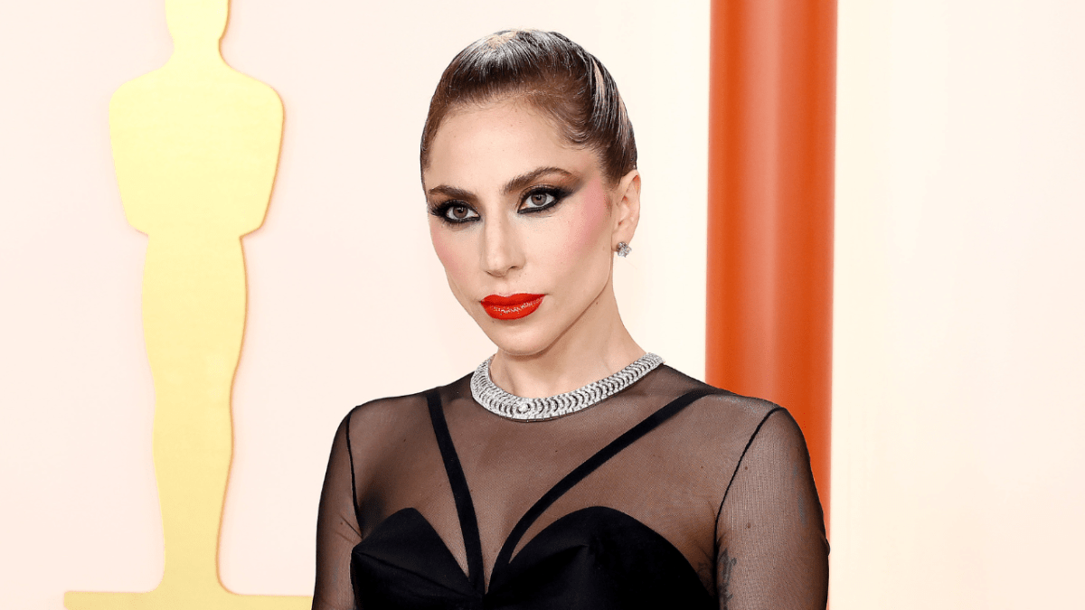 Lady Gaga attends the 95th Annual Academy Awards wearing a see-through black dress and a diamond choker