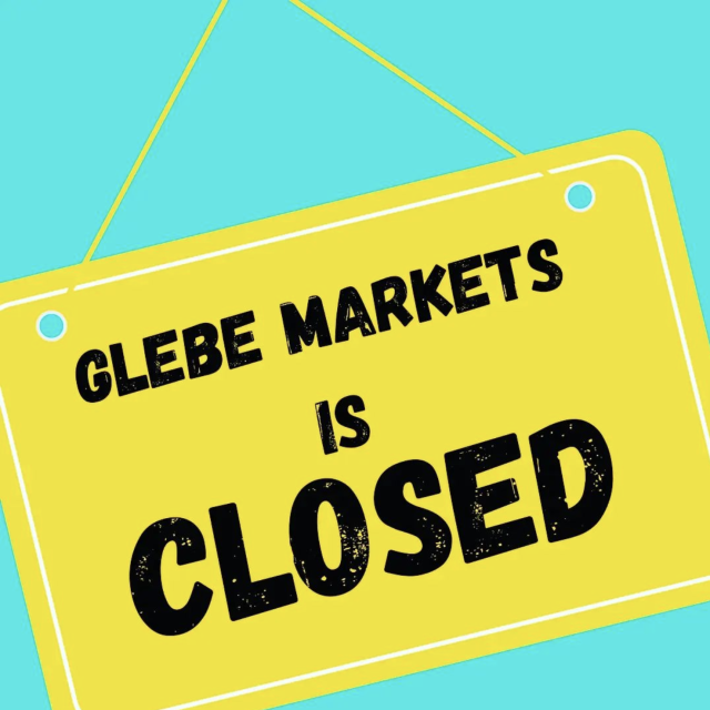 A blue background with a yellow sign that says "glebe markets is closed"