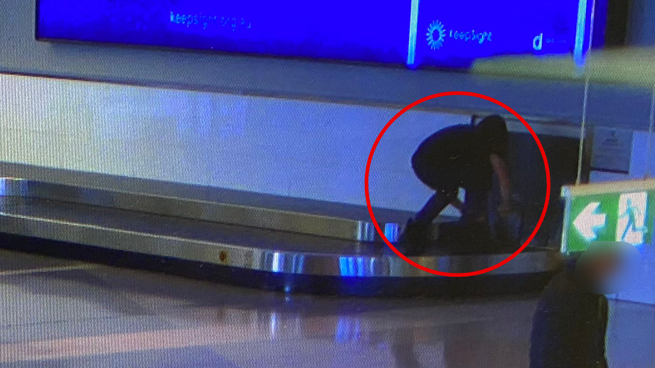 Photo of teenager allegedly riding Canberra Airport baggage carousel