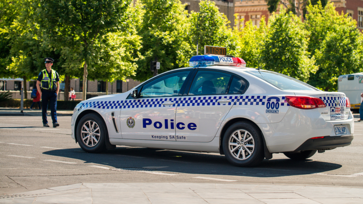 55 Y.O. Man Arrested After Allegedly Exposing Himself To SA School Girls & Trying To Grab Teen. The man was denied bail on charges of indecent behaviour and assault. image of is of a south australia police car.