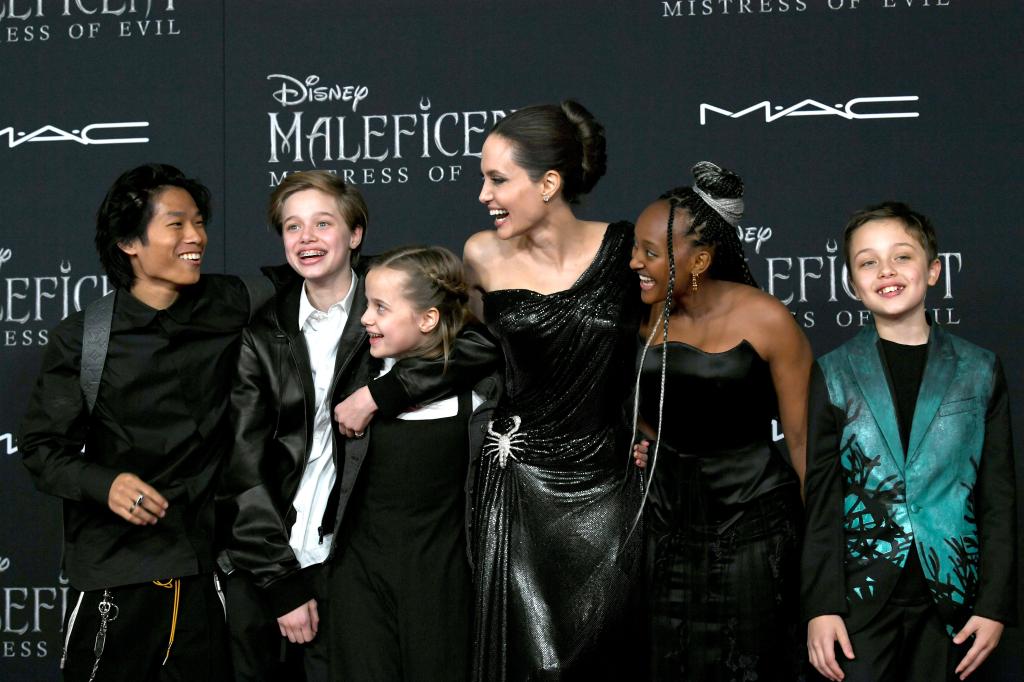 Pax Jolie-Pitt with his siblings Shiloh, Vivienne, Zahara and Knox at the premiere of Maleficent: Mistress Of Evil alongside Angelina Jolie in 2019. (Image: Kevin Winter/Getty Images)