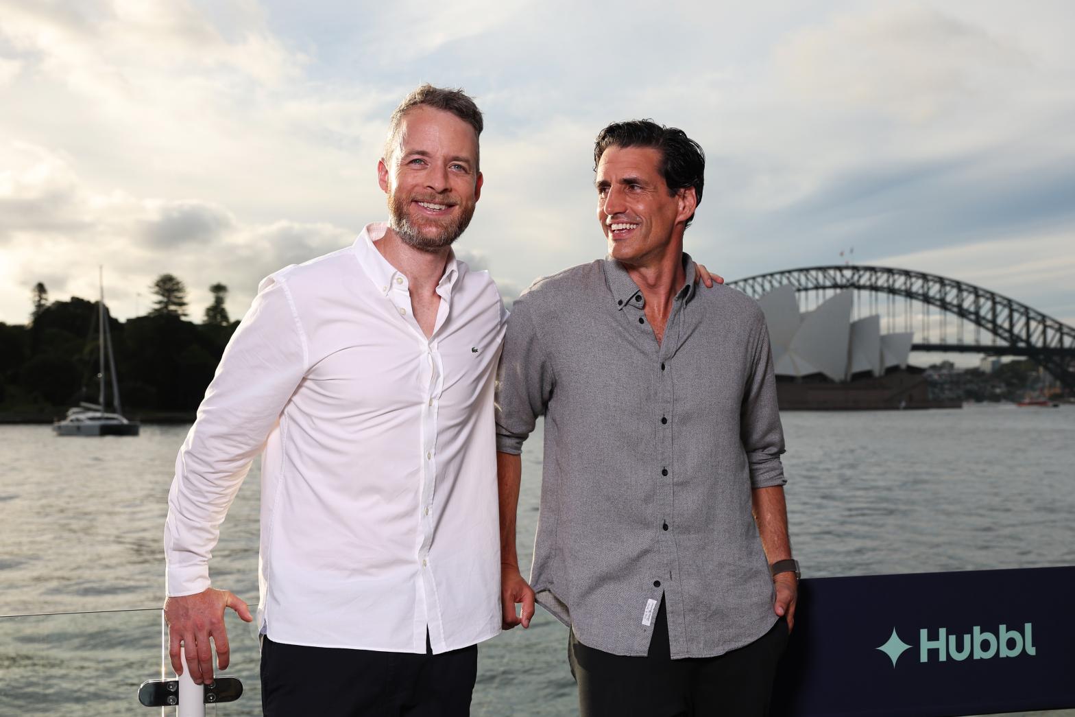 Hamish and Andy stand in front of the Sydney Harbour Bridge