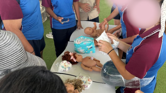 A Brisbane School Thought It Would Be A Good Idea To Hold Nappy-Changing Lessons On IWD